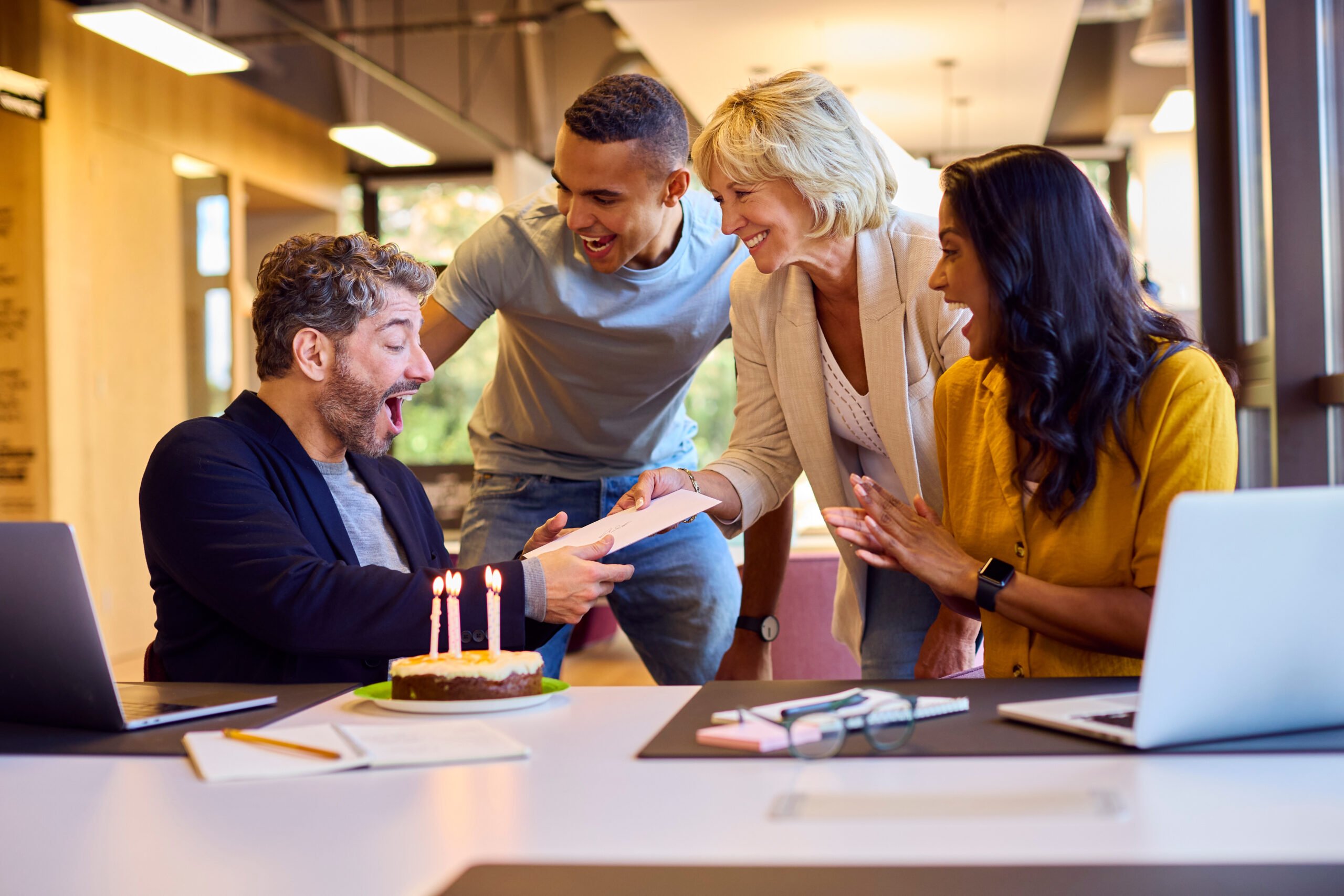 Colleague receiving office birthday card