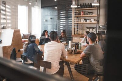 Group of coworkers sitting around table