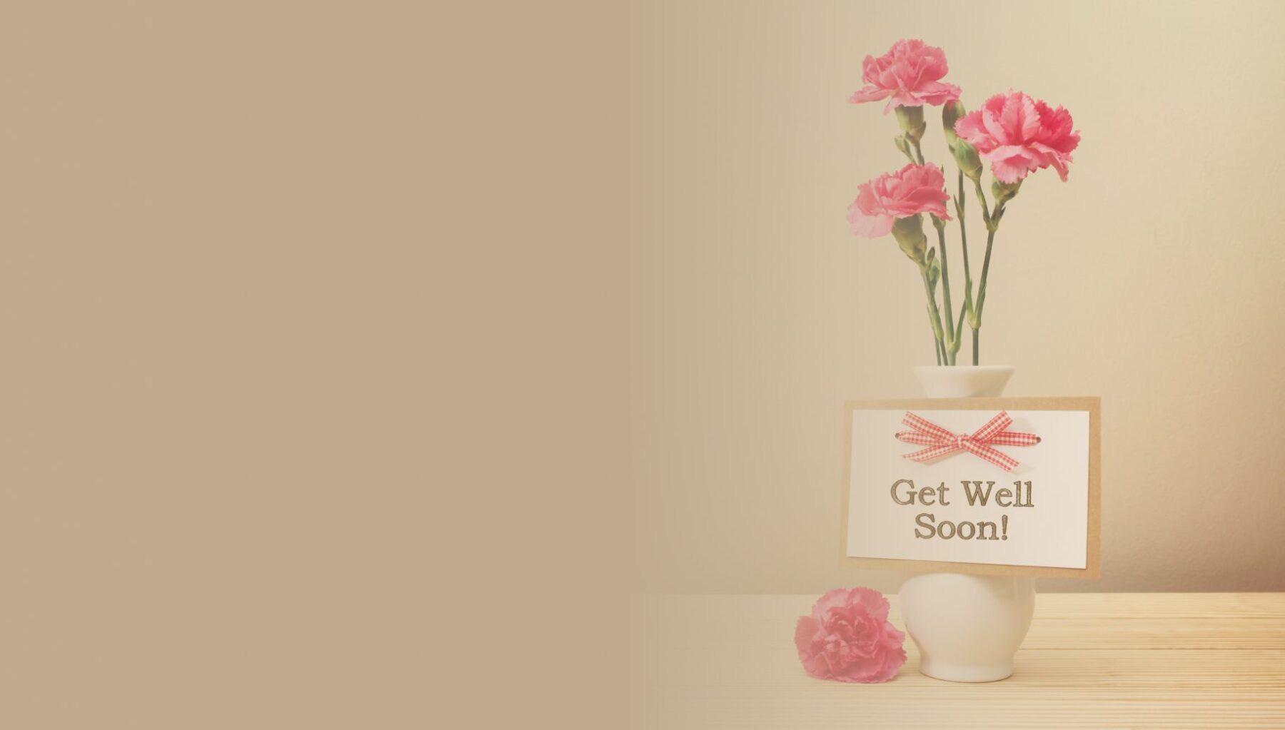 Get well soon flowers in vase with card