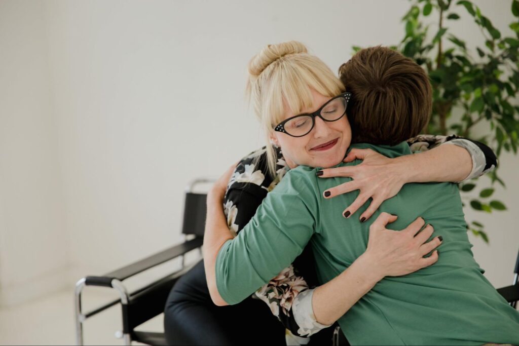 Retiring mentor hugging another person